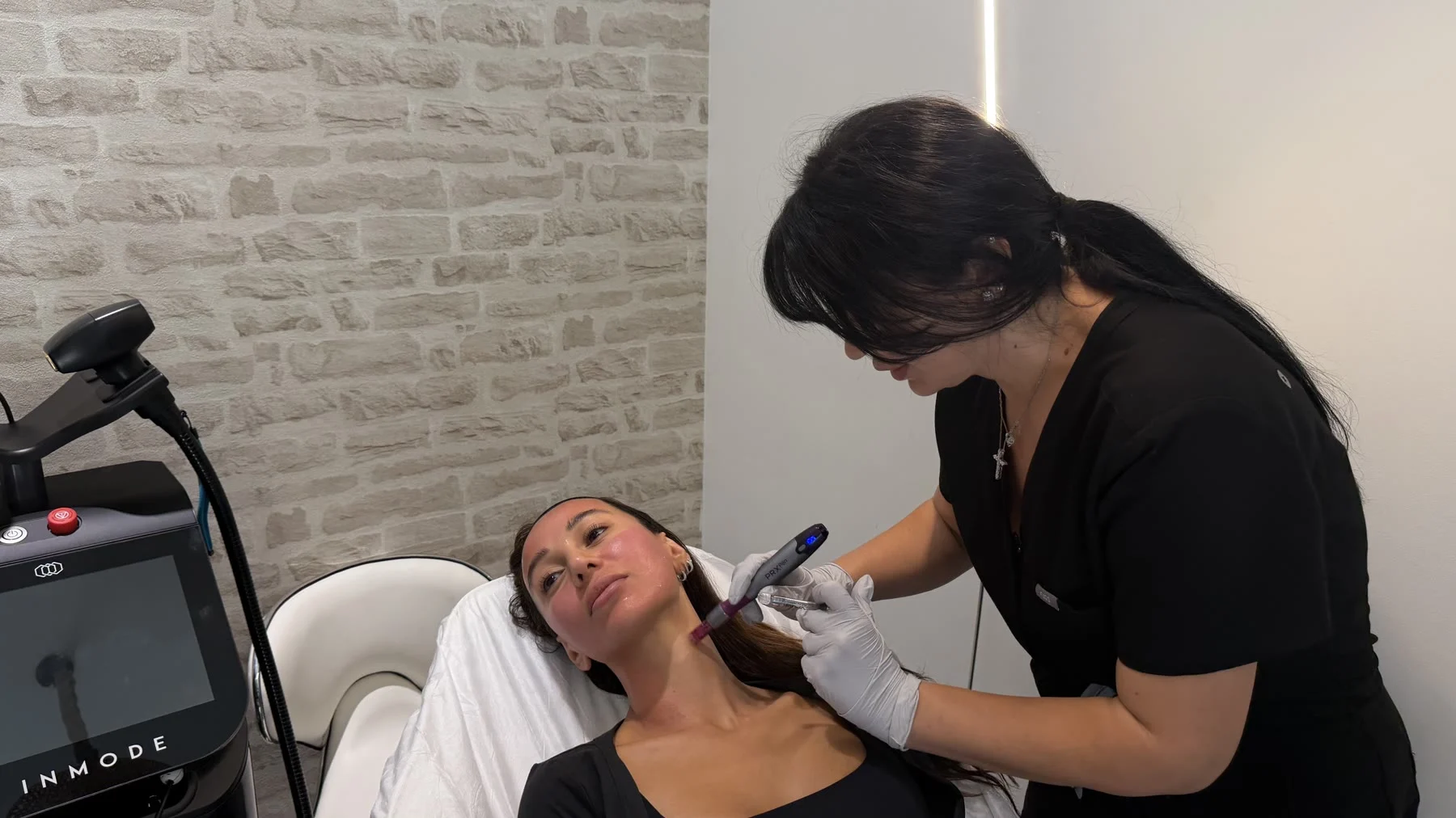 Tatev performing VAMP Advanced microneedling at Tate Aesthetics